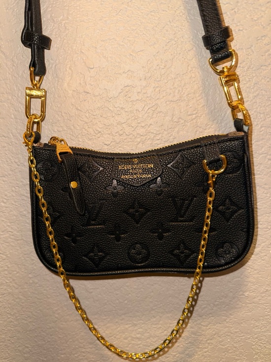 Louis Vuitton Handbags - Louis Vuitton Black Embossed Monogram Mini Pochette with Gold Hardware